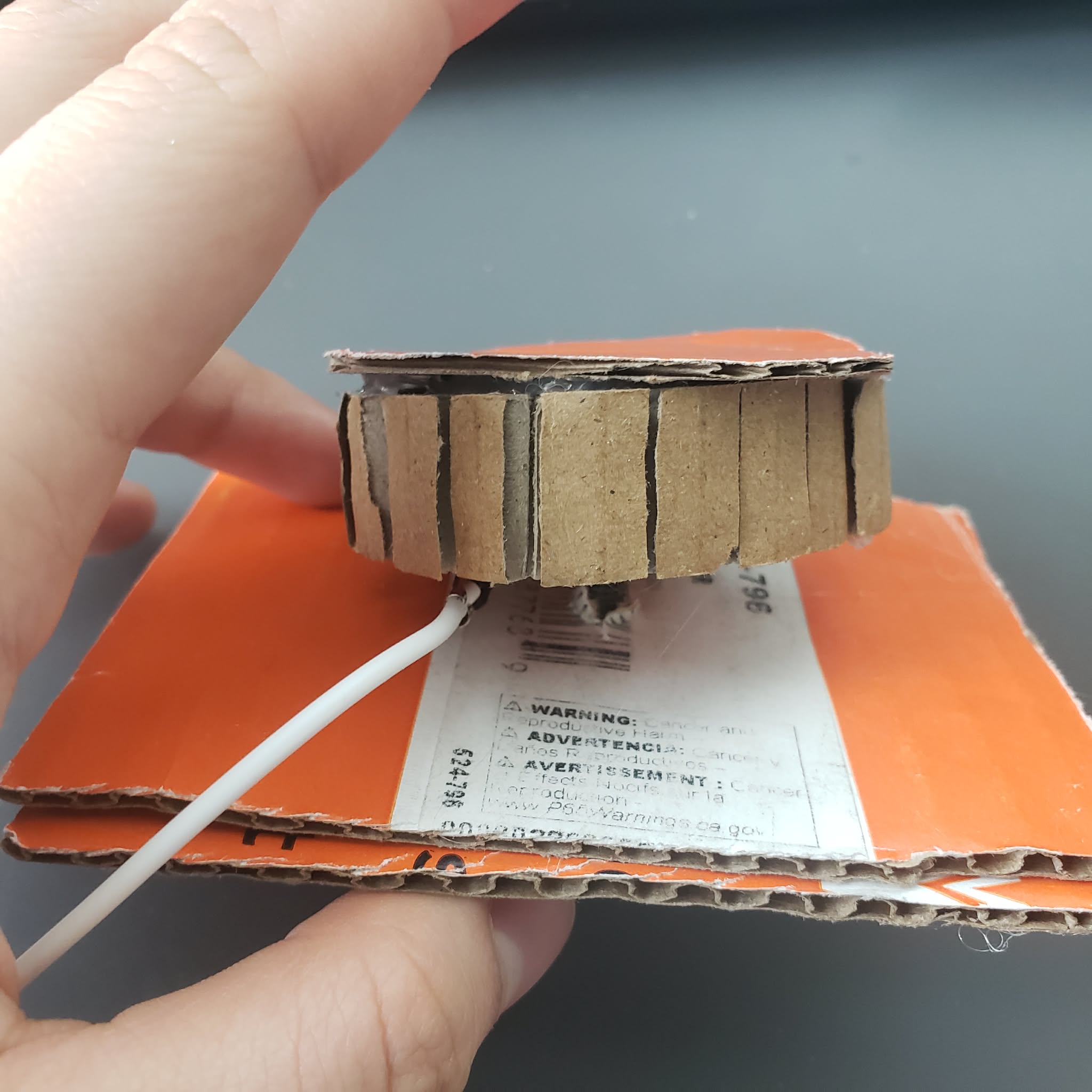 This is a prototype of a pump needle. The ground is connected to a screw inside the prototype. the white wire is the alligator clip that connected to the copper tape