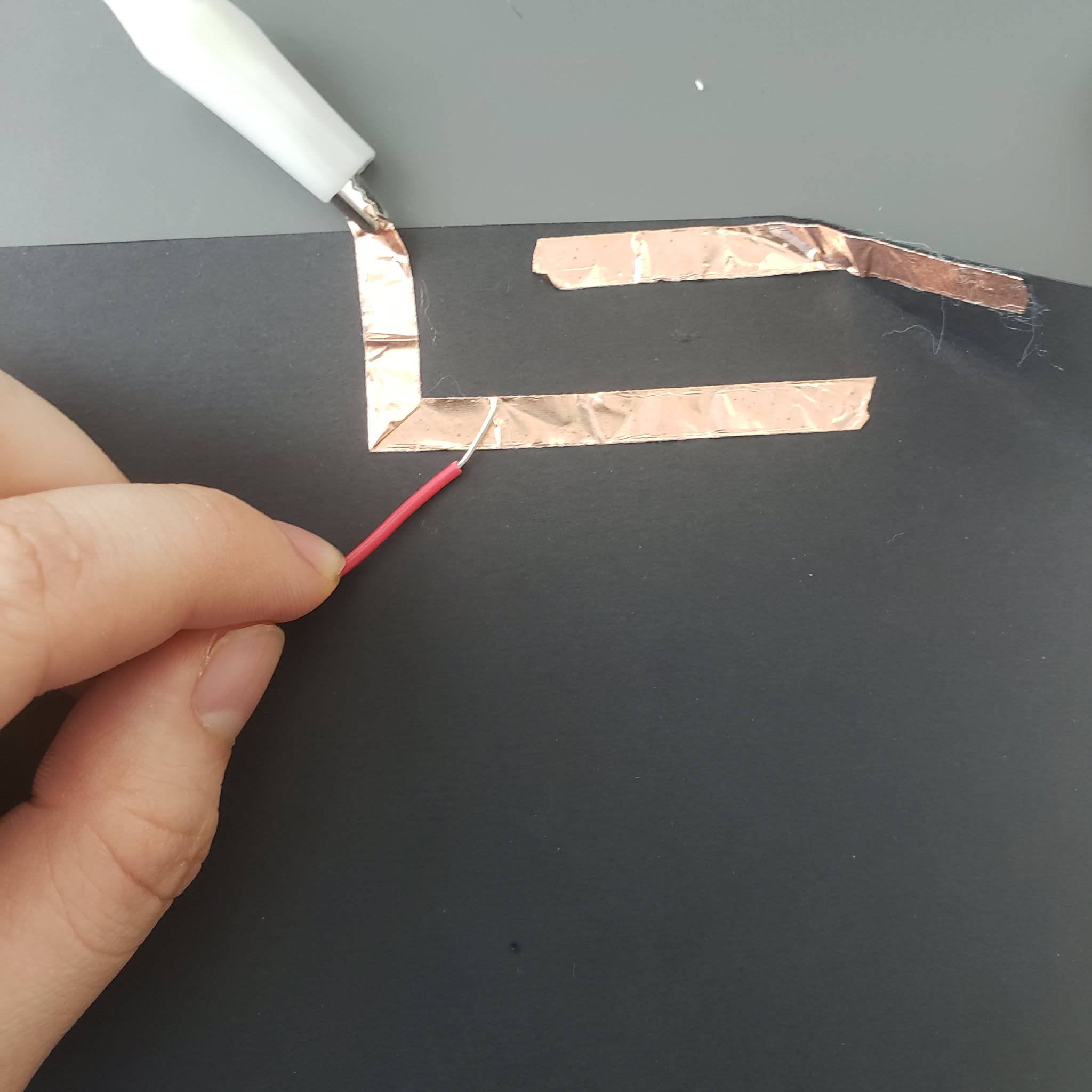 I connect the interaction by touching the copper with the paper.