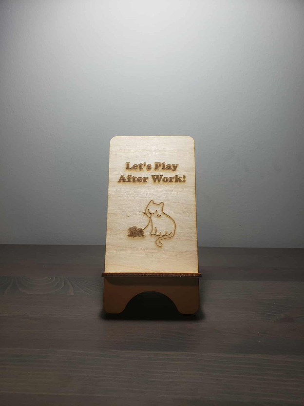 Different views of the wooden phone holder.