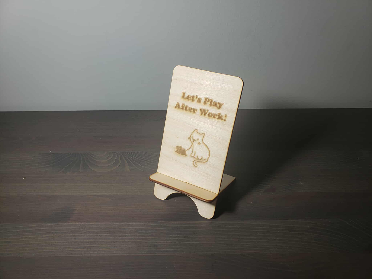 Different views of the wooden phone holder.