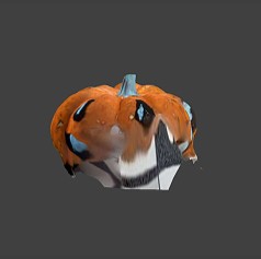 3D scanned colored pumpkin. A part of it is fused with the floor.